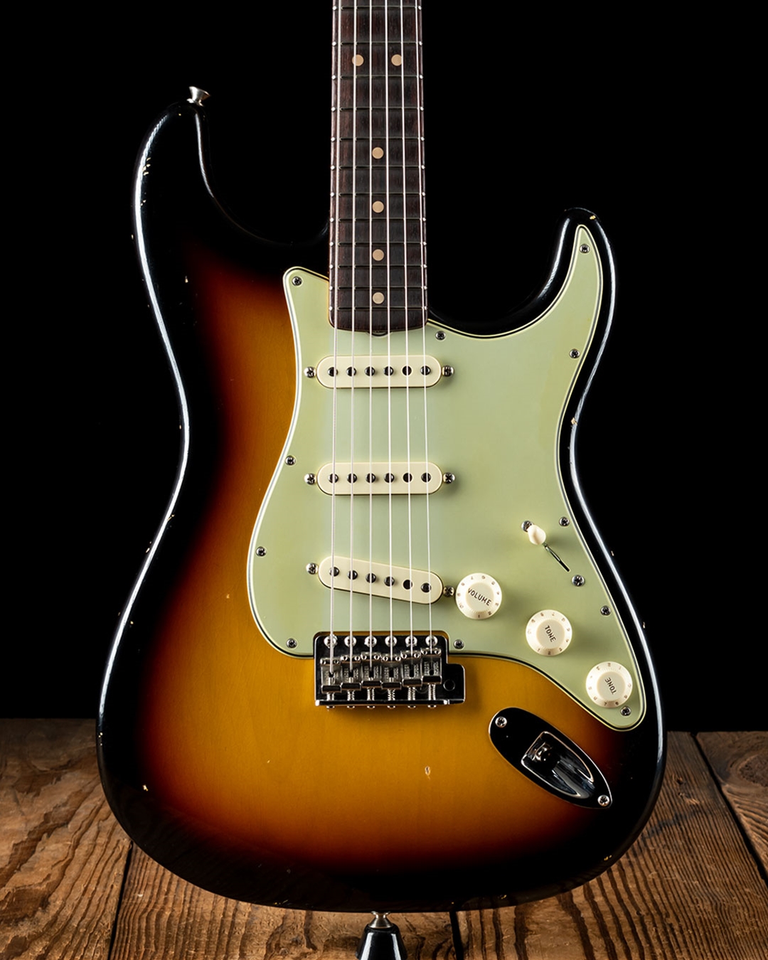 Mint green pickguard on sunburst outlet strat